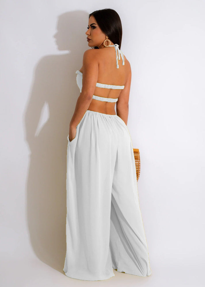 Alia - Off-the-shoulder jumpsuit met wijde pijpen