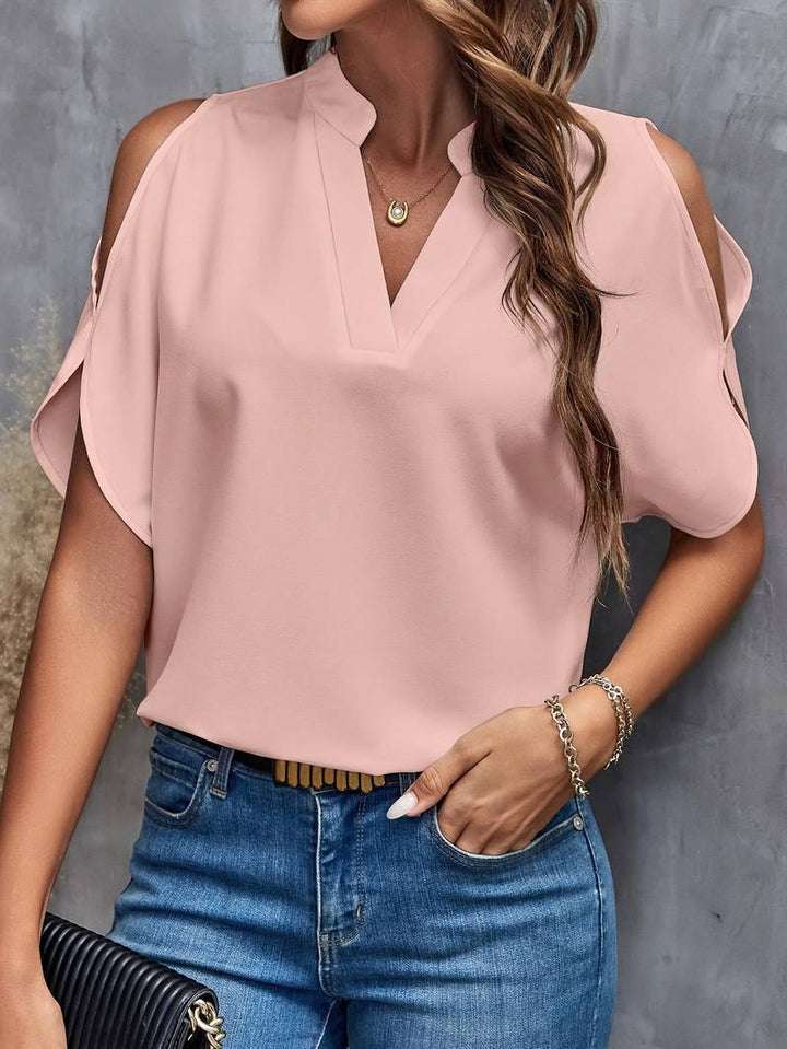 Kris - Effen blouse met inkepingen en eenvoudige elegante split mouwen